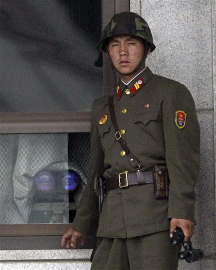 A North Korean soldier observes the South at the truce village of Panmunjom in the demilitarized zone that separates the two Koreas.